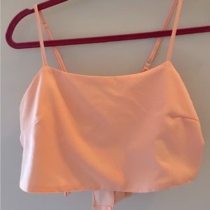 Peach pink crop top adjustable straps and ties in the back